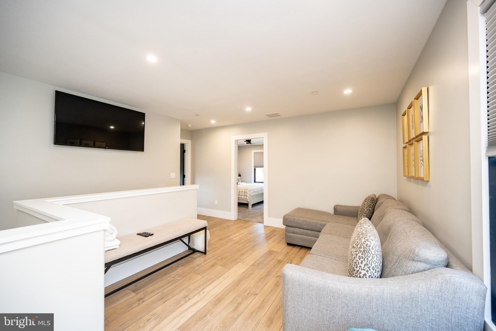 415 Mountaintop Road McHenry, MD 21541 - Photo 47 of 134 a living room with furniture and a flat screen tv