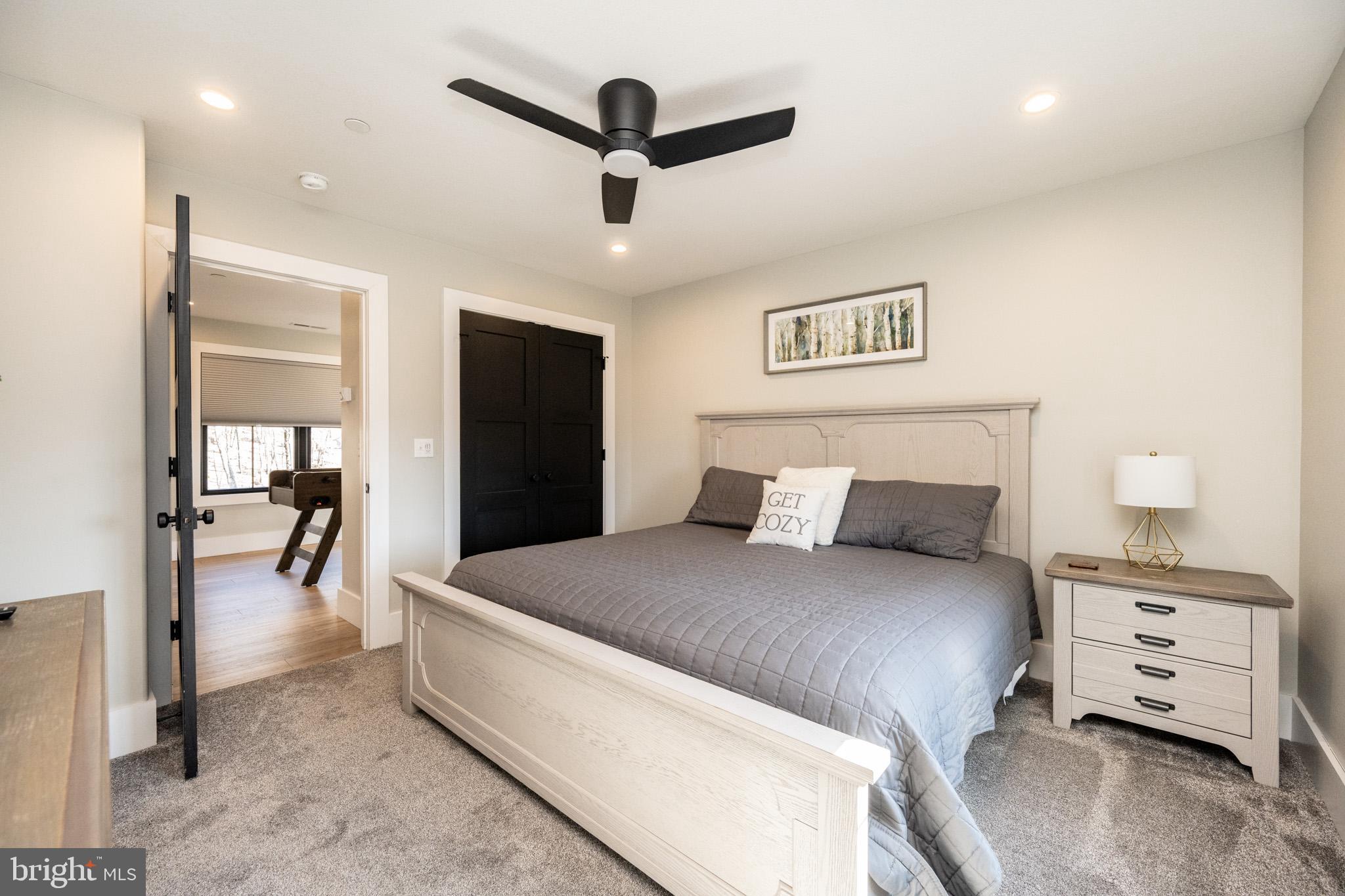 415 Mountaintop Road McHenry, MD 21541 - Photo 51 of 134 a large bedroom with a bed and a view of living room