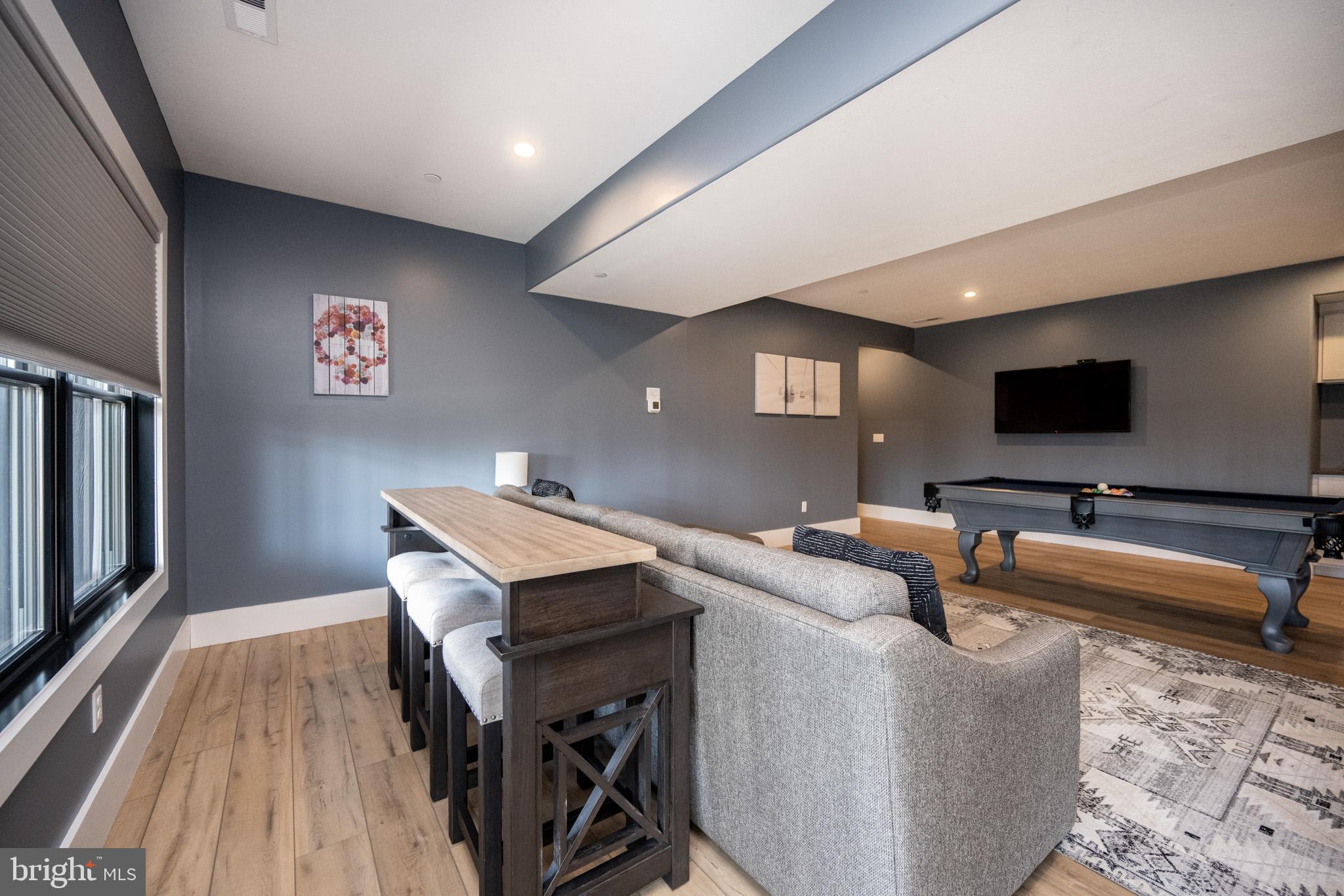 415 Mountaintop Road McHenry, MD 21541 - Photo 66 of 134 a living room with furniture and a flat screen tv