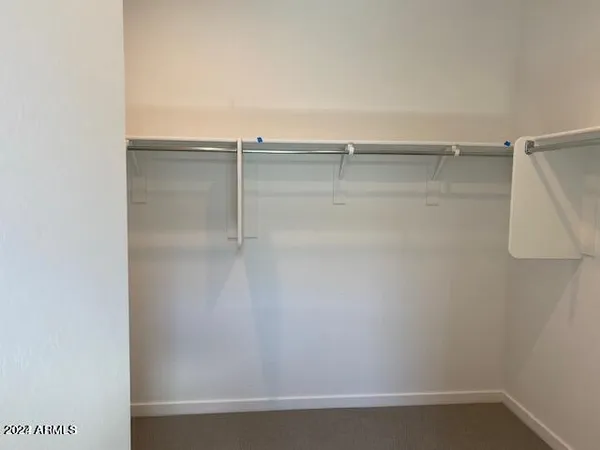 a view of a room with shelf on the wall