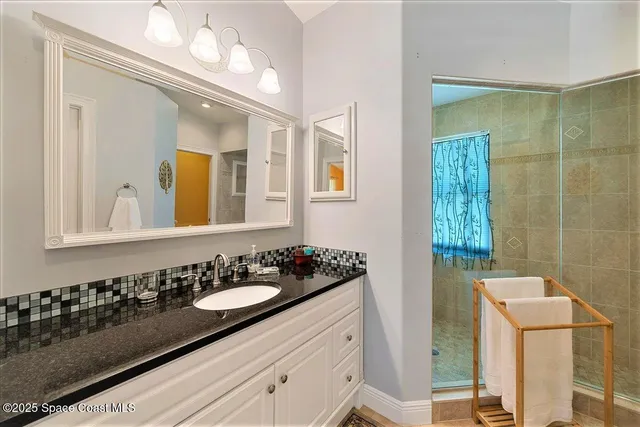 a bathroom with a shower and a tub