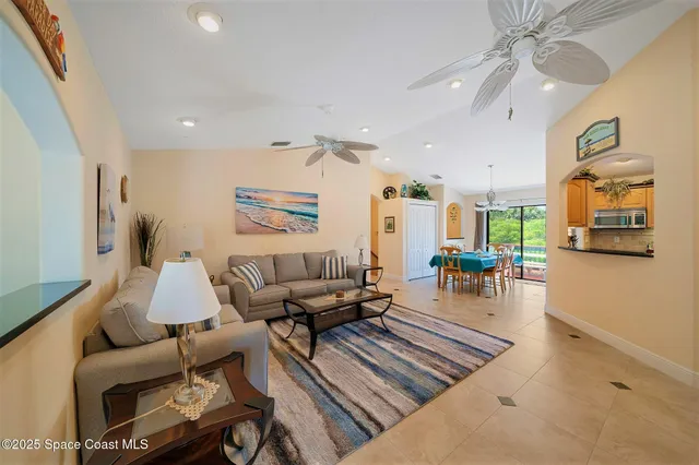 a kitchen with stainless steel appliances granite countertop a sink refrigerator and cabinets