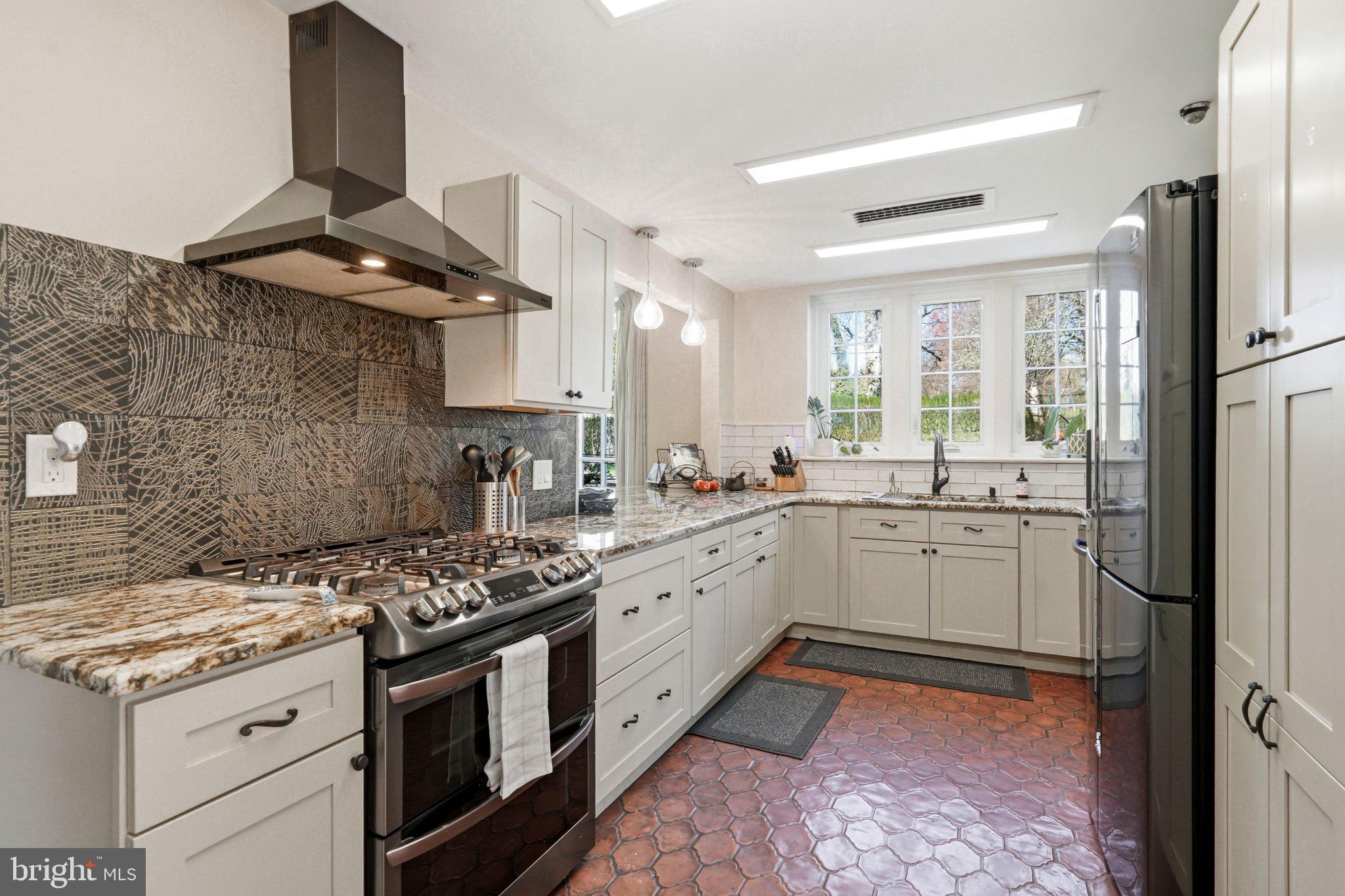 1735 Ashbourne Road Elkins Park, PA 19027 - Photo 18 of 82 a kitchen with a stove oven and sink