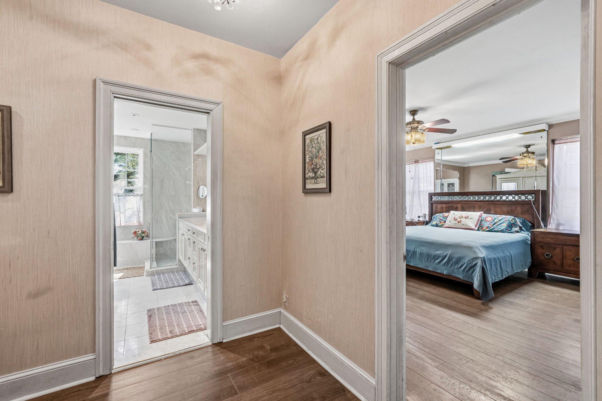 1735 Ashbourne Road Elkins Park, PA 19027 - Photo 27 of 82 a bedroom with a large bed and a wooden floor