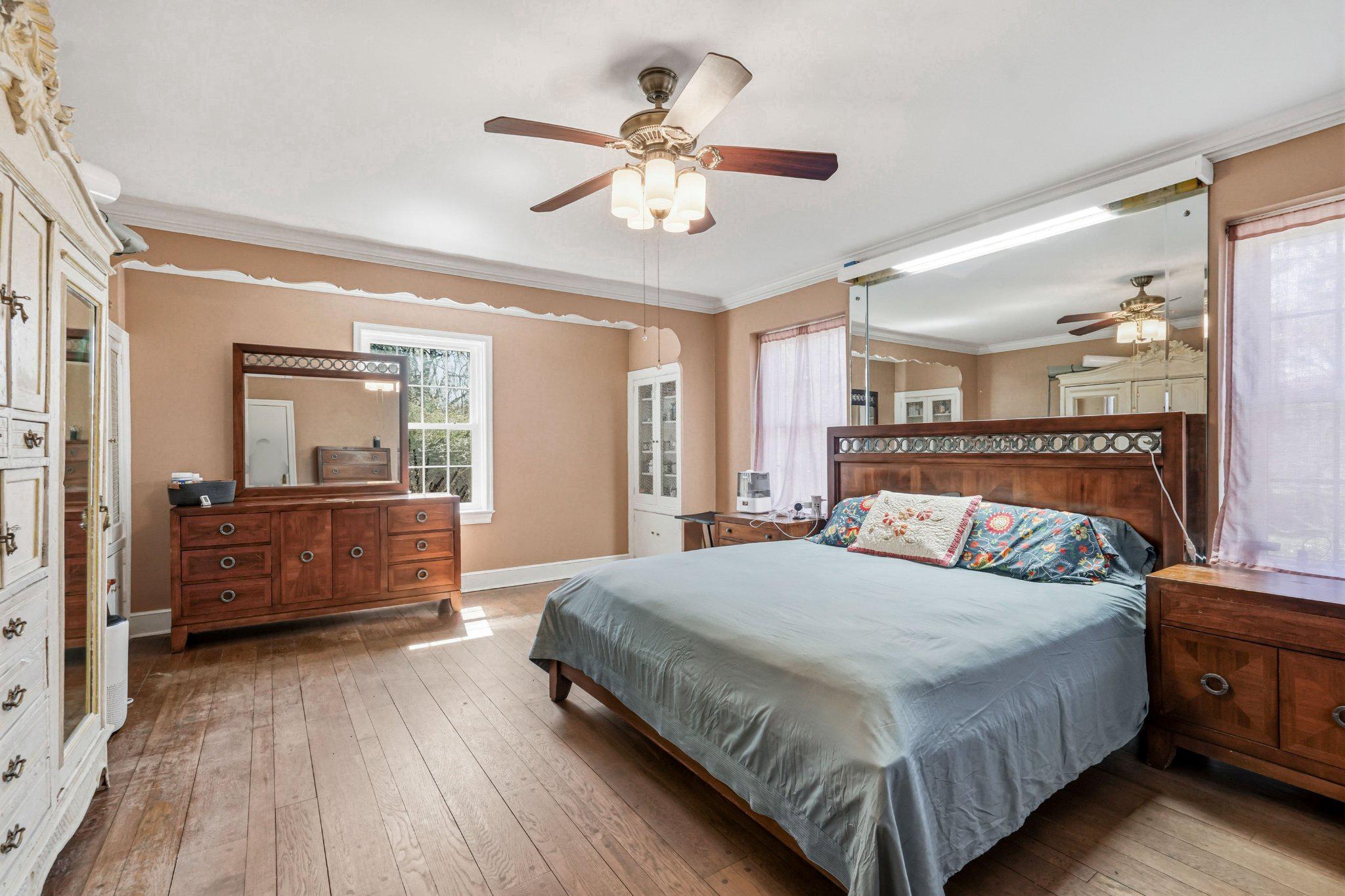 1735 Ashbourne Road Elkins Park, PA 19027 - Photo 28 of 82 a bedroom with a bed and a chandelier