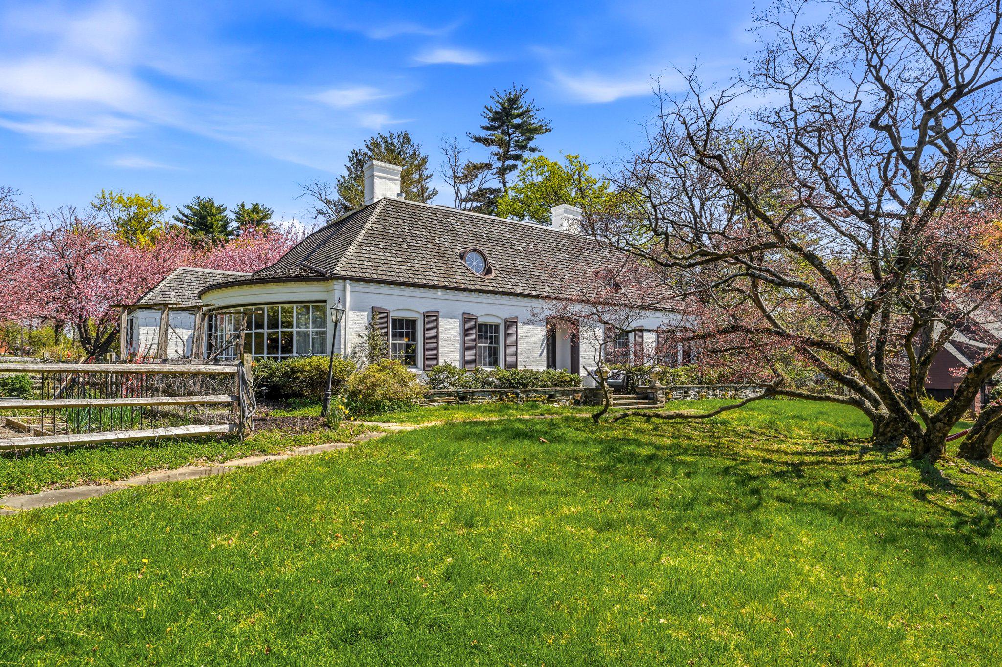 1735 Ashbourne Road Elkins Park, PA 19027 - Photo 3 of 82 a front view of a house with a yard table and chairs