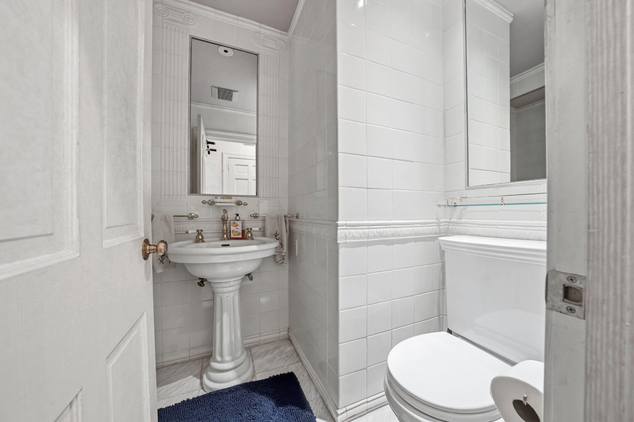 1735 Ashbourne Road Elkins Park, PA 19027 - Photo 34 of 82 a bathroom with a sink a toilet and shower