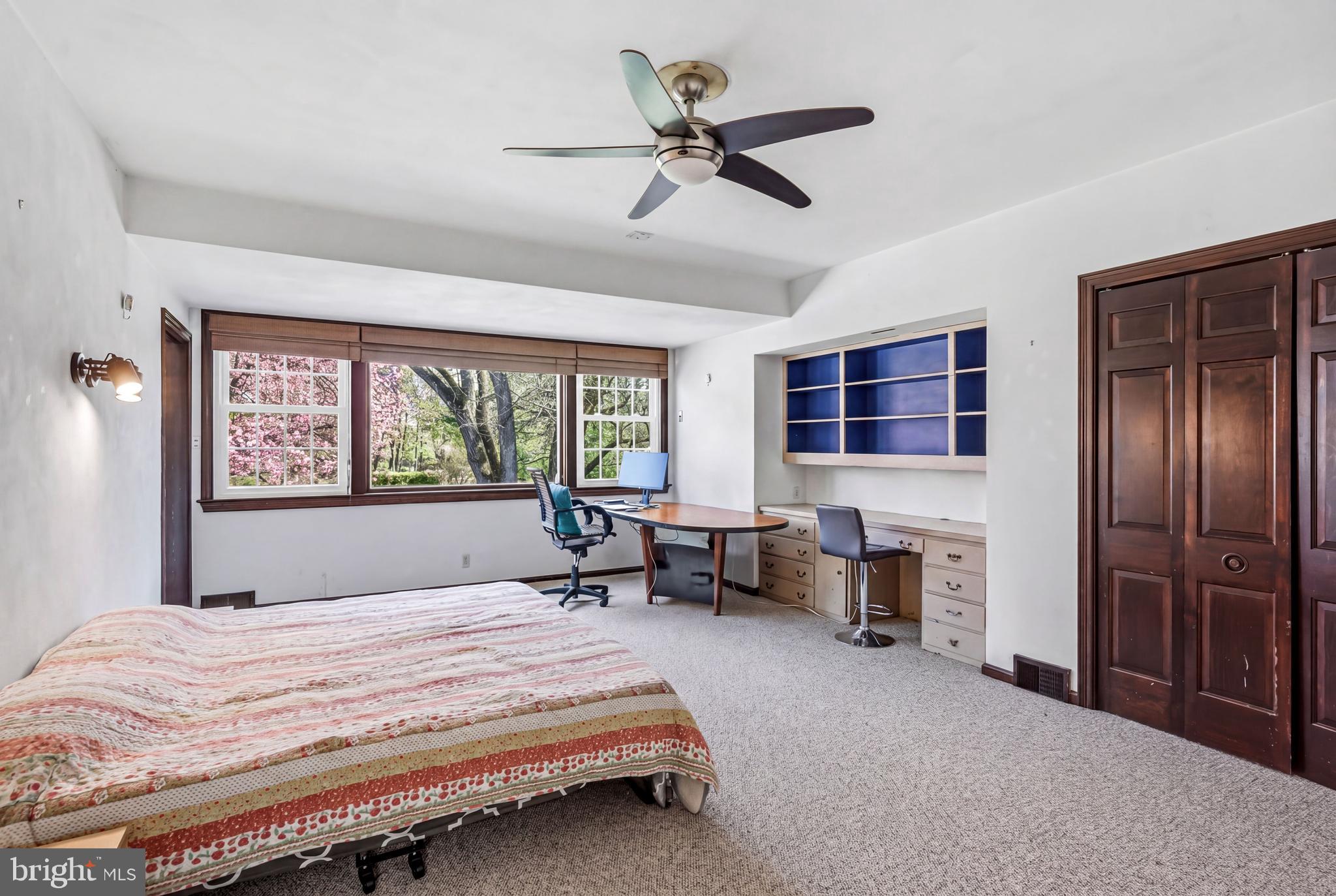 1735 Ashbourne Road Elkins Park, PA 19027 - Photo 40 of 82 a bedroom with a balcony a bed and a chandelier