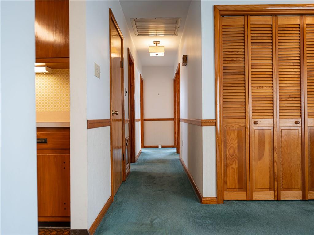 1012 Blaine Road Monaca, PA 15061 - Photo 15 of 50 a view of a hallway with wooden floor and a bathroom