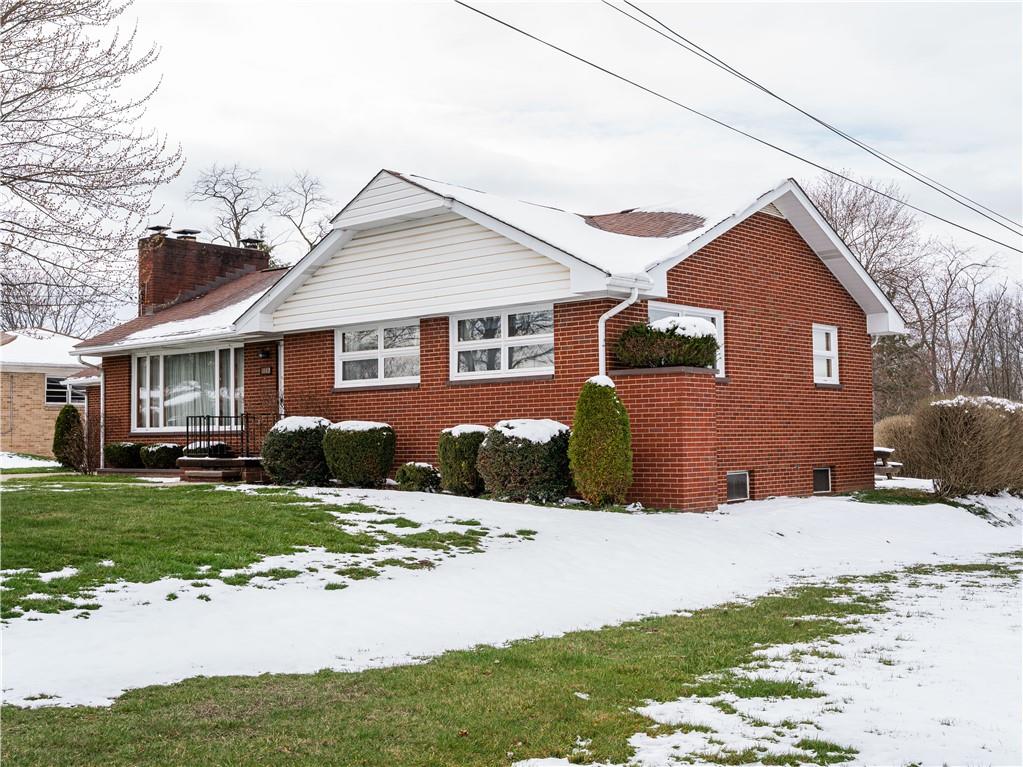 1012 Blaine Road Monaca, PA 15061 - Photo 3 of 50 a front view of a house with a yard