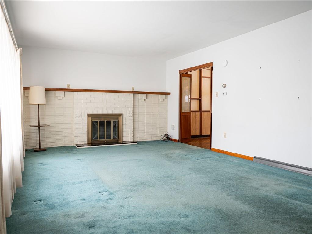 1012 Blaine Road Monaca, PA 15061 - Photo 4 of 50 an empty room with fireplace