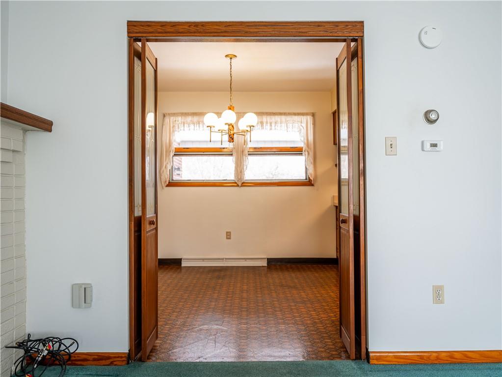 1012 Blaine Road Monaca, PA 15061 - Photo 9 of 50 a view of an empty room with wooden floor and a window