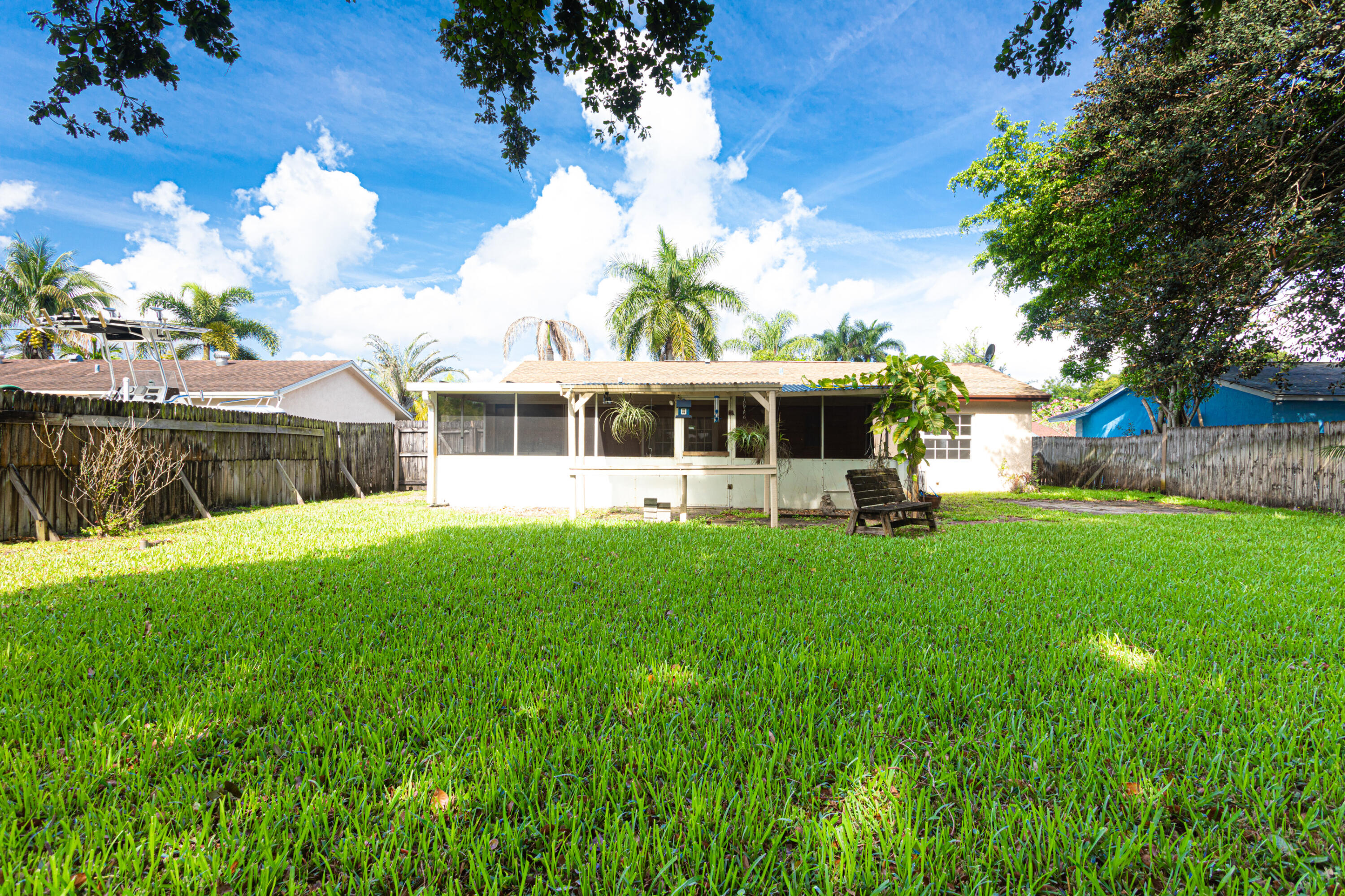 4661 Poseidon Place Lake Worth, FL 33463 - Photo 13 of 36 a view of a house with a backyard porch and sitting area