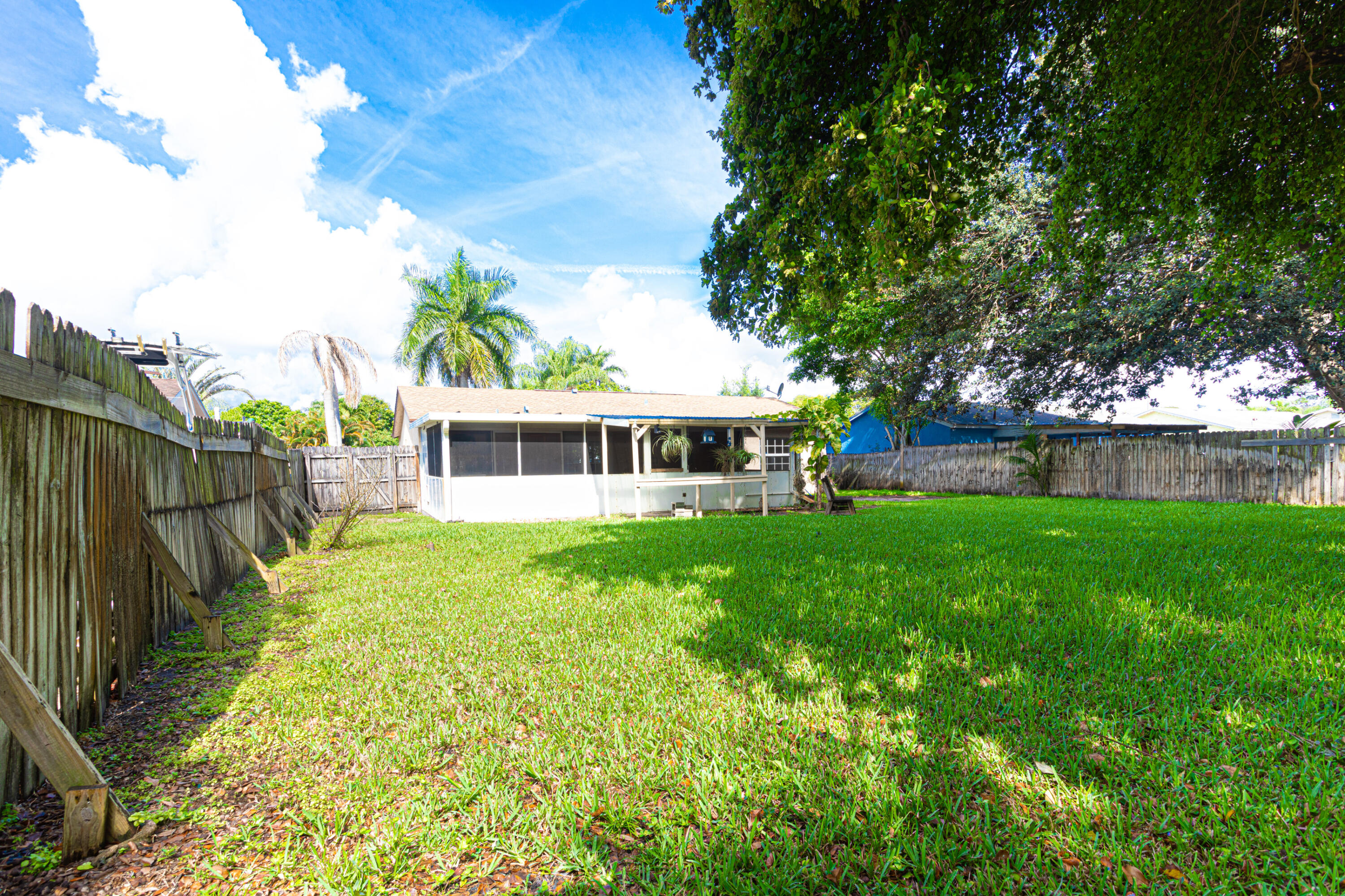 4661 Poseidon Place Lake Worth, FL 33463 - Photo 14 of 36 a view of a house with a backyard
