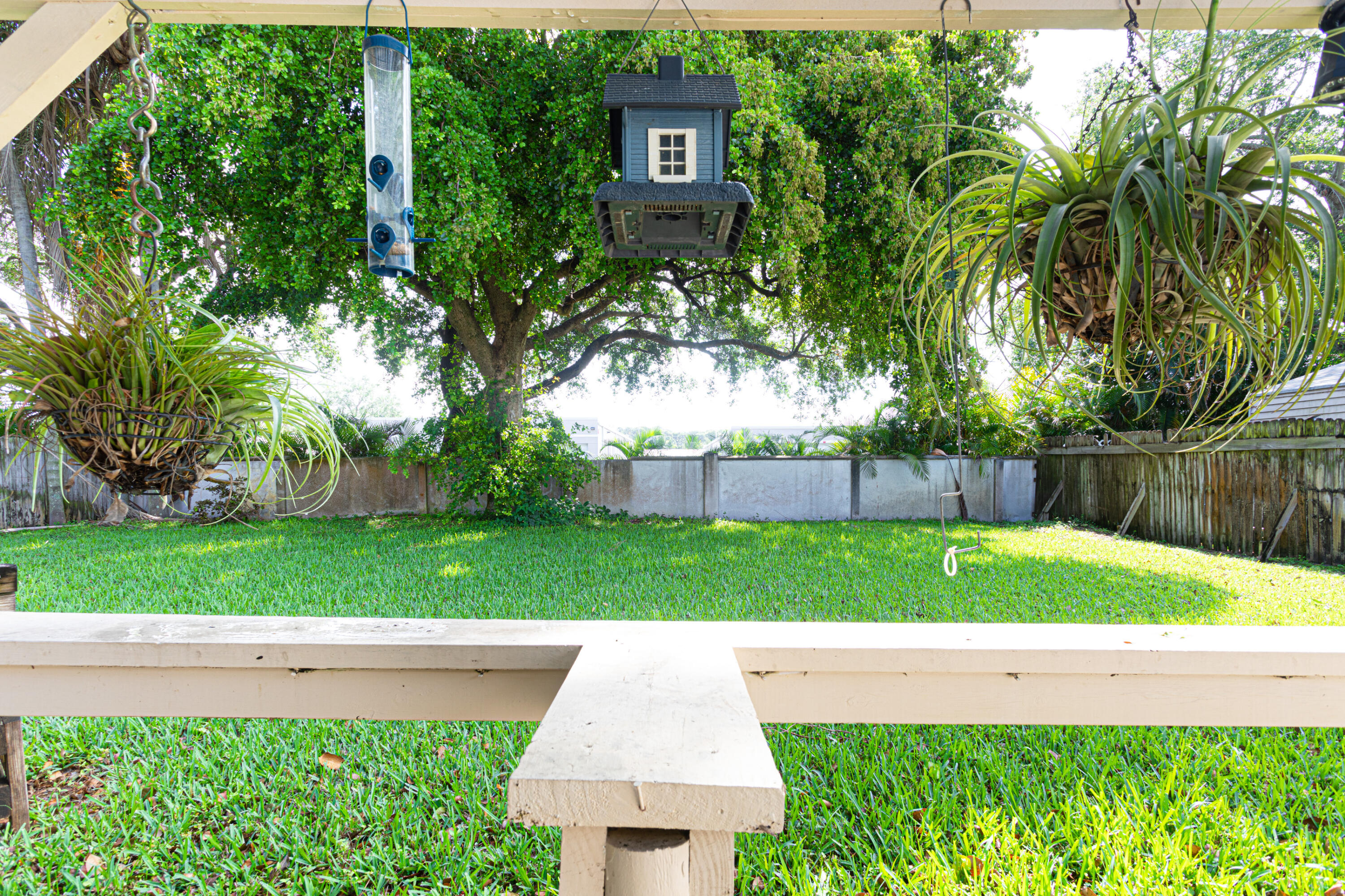 4661 Poseidon Place Lake Worth, FL 33463 - Photo 16 of 36 a backyard of a house with lots of green space