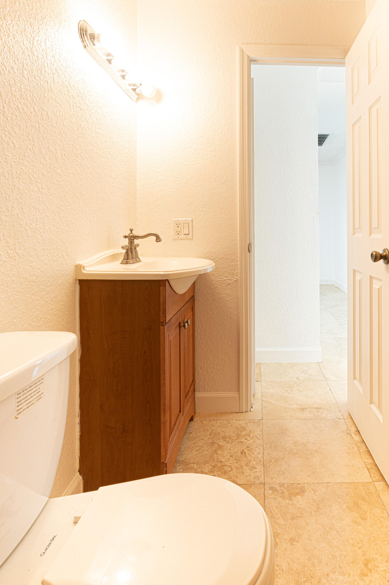 4661 Poseidon Place Lake Worth, FL 33463 - Photo 21 of 36 a bathroom with a sink and a mirror