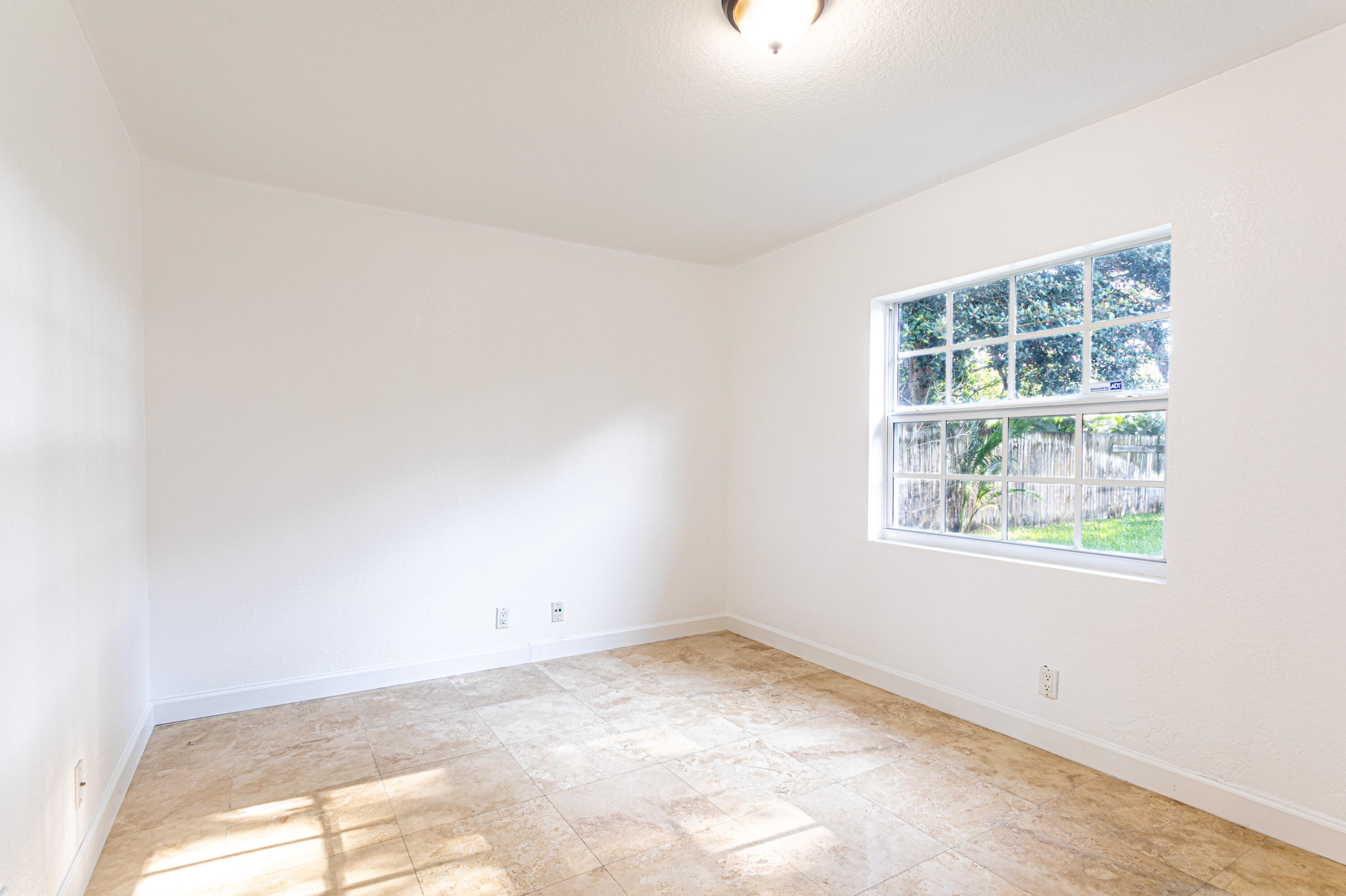 4661 Poseidon Place Lake Worth, FL 33463 - Photo 23 of 36 an empty room with a window