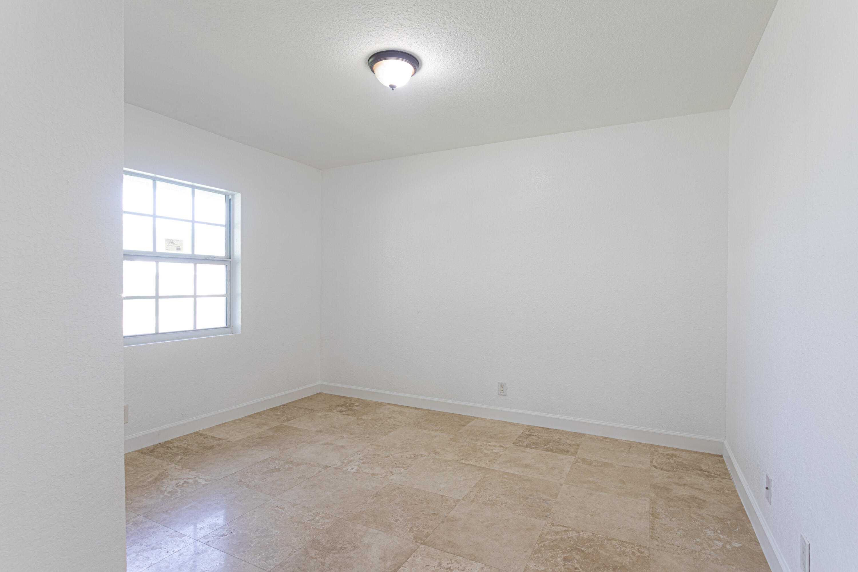 4661 Poseidon Place Lake Worth, FL 33463 - Photo 24 of 36 an empty room with a window