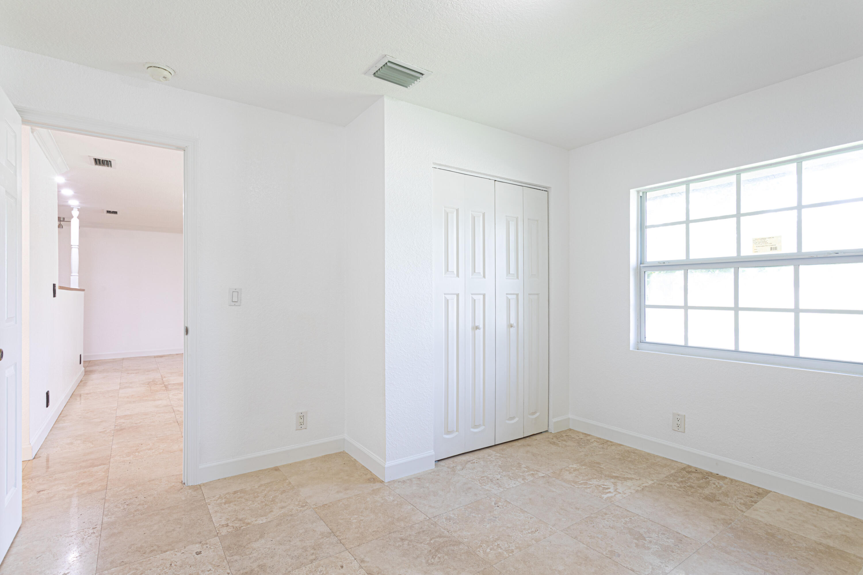 4661 Poseidon Place Lake Worth, FL 33463 - Photo 25 of 36 an empty room with windows and closet