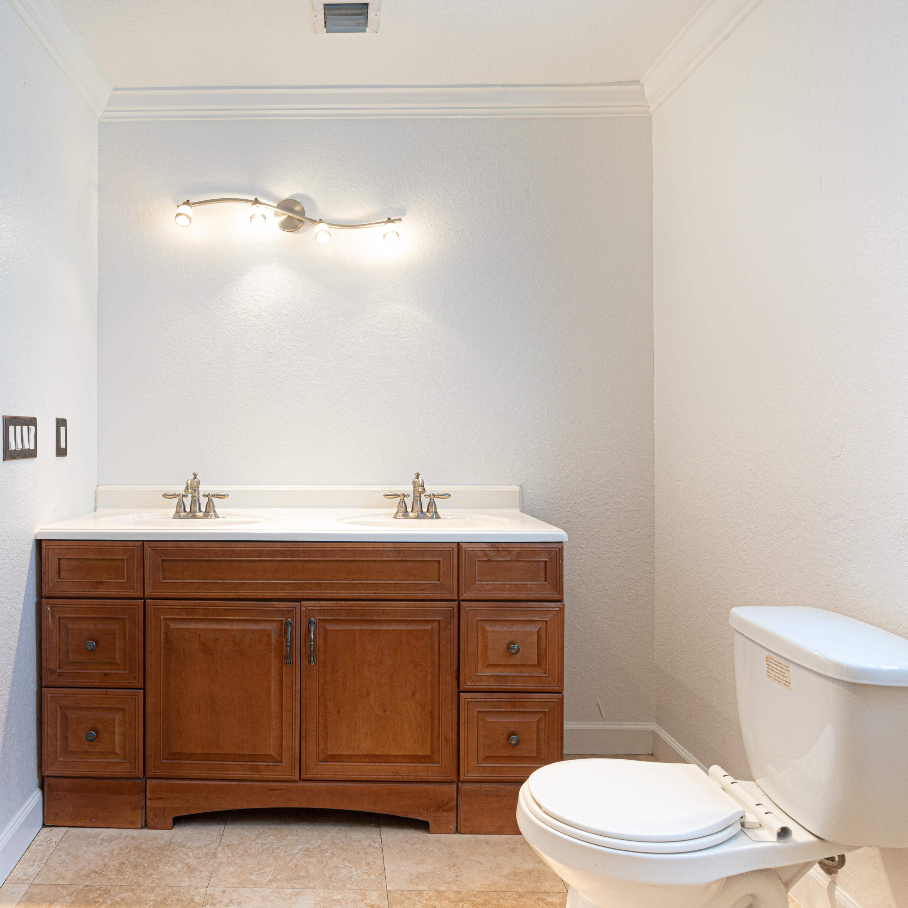 4661 Poseidon Place Lake Worth, FL 33463 - Photo 27 of 36 a bathroom with a sink a mirror and a toilet
