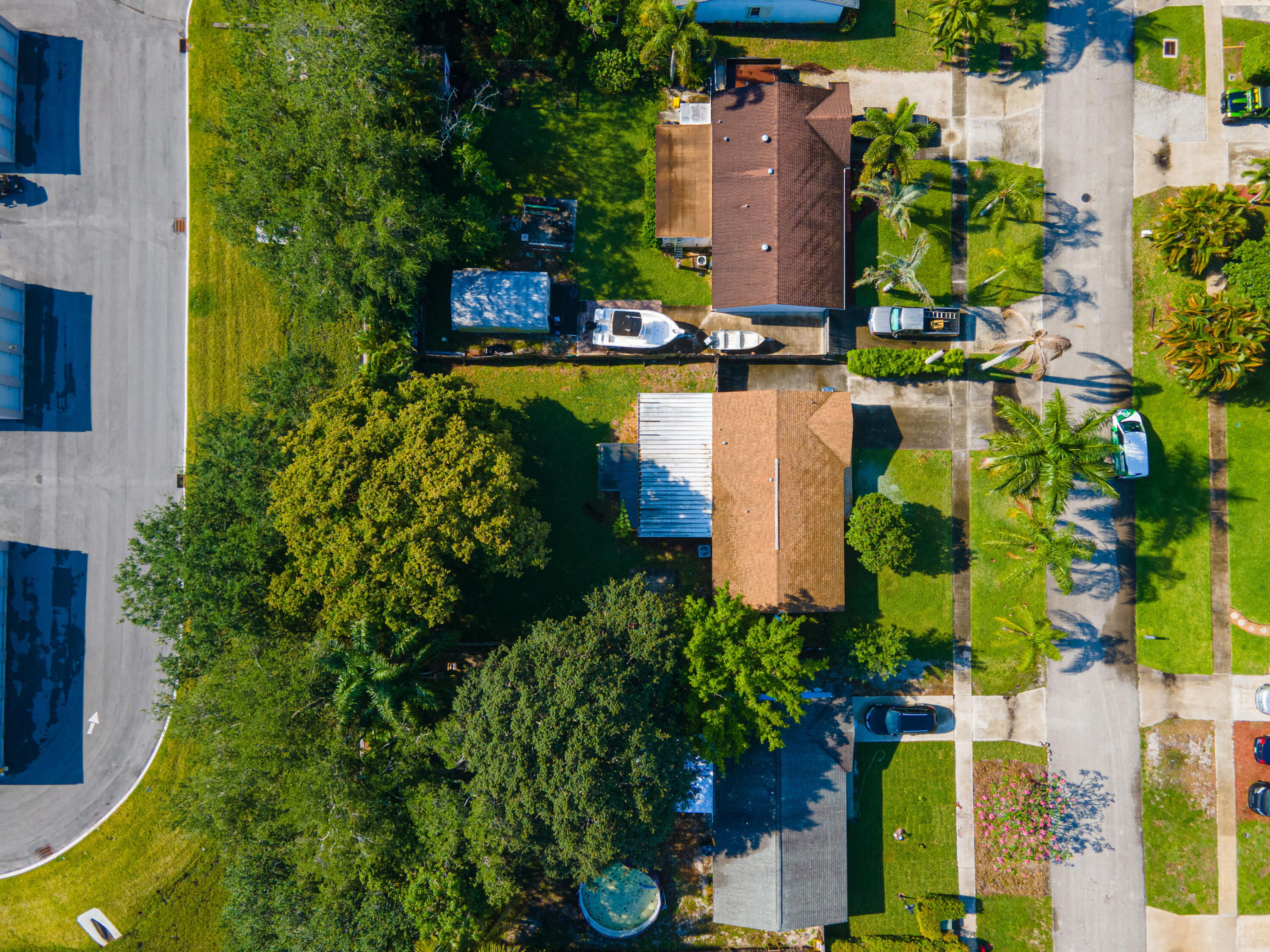 4661 Poseidon Place Lake Worth, FL 33463 - Photo 3 of 36 an aerial view of a house with a yard and garden