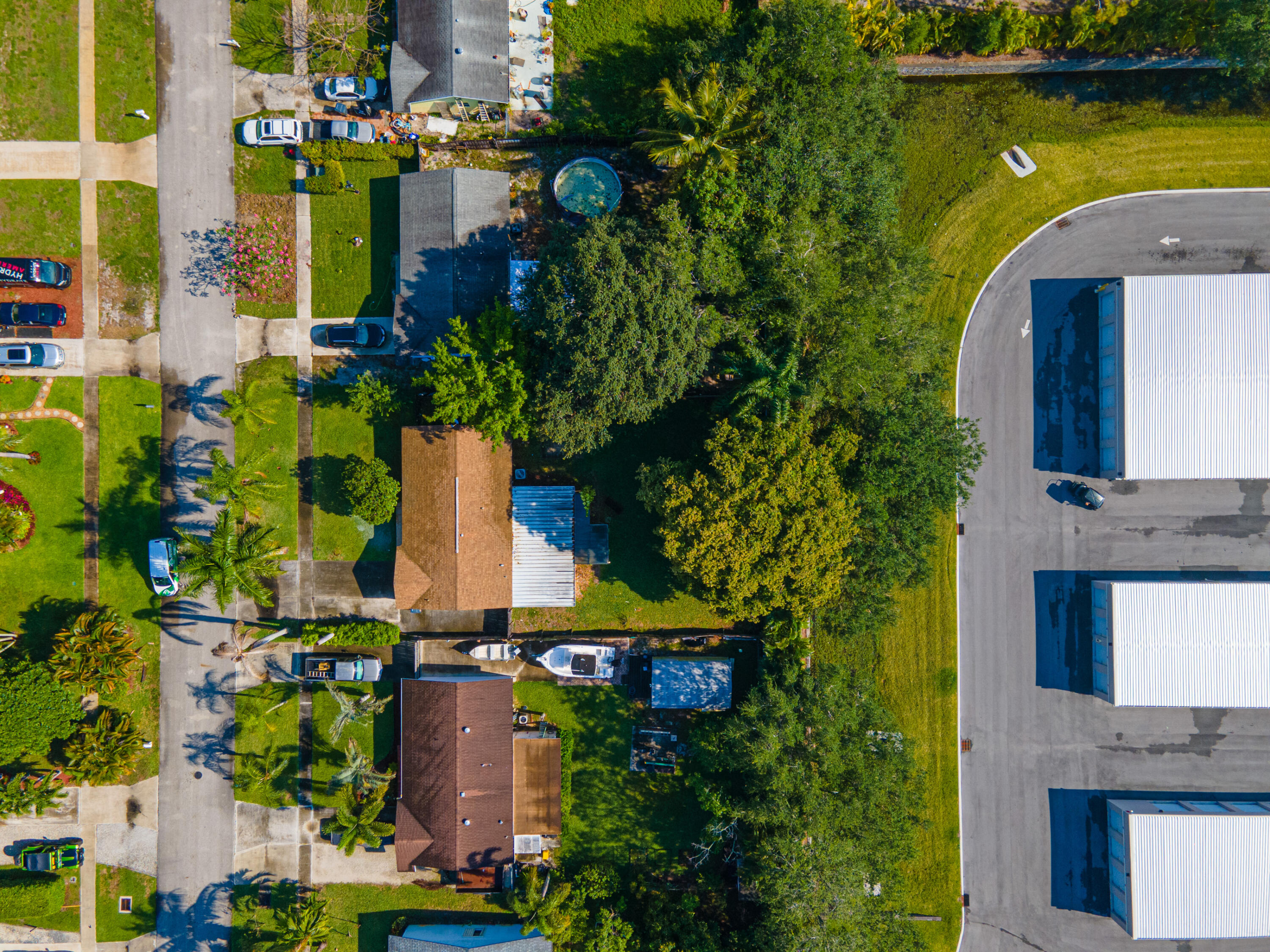 4661 Poseidon Place Lake Worth, FL 33463 - Photo 5 of 36 an aerial view of a house with a garden and lake view