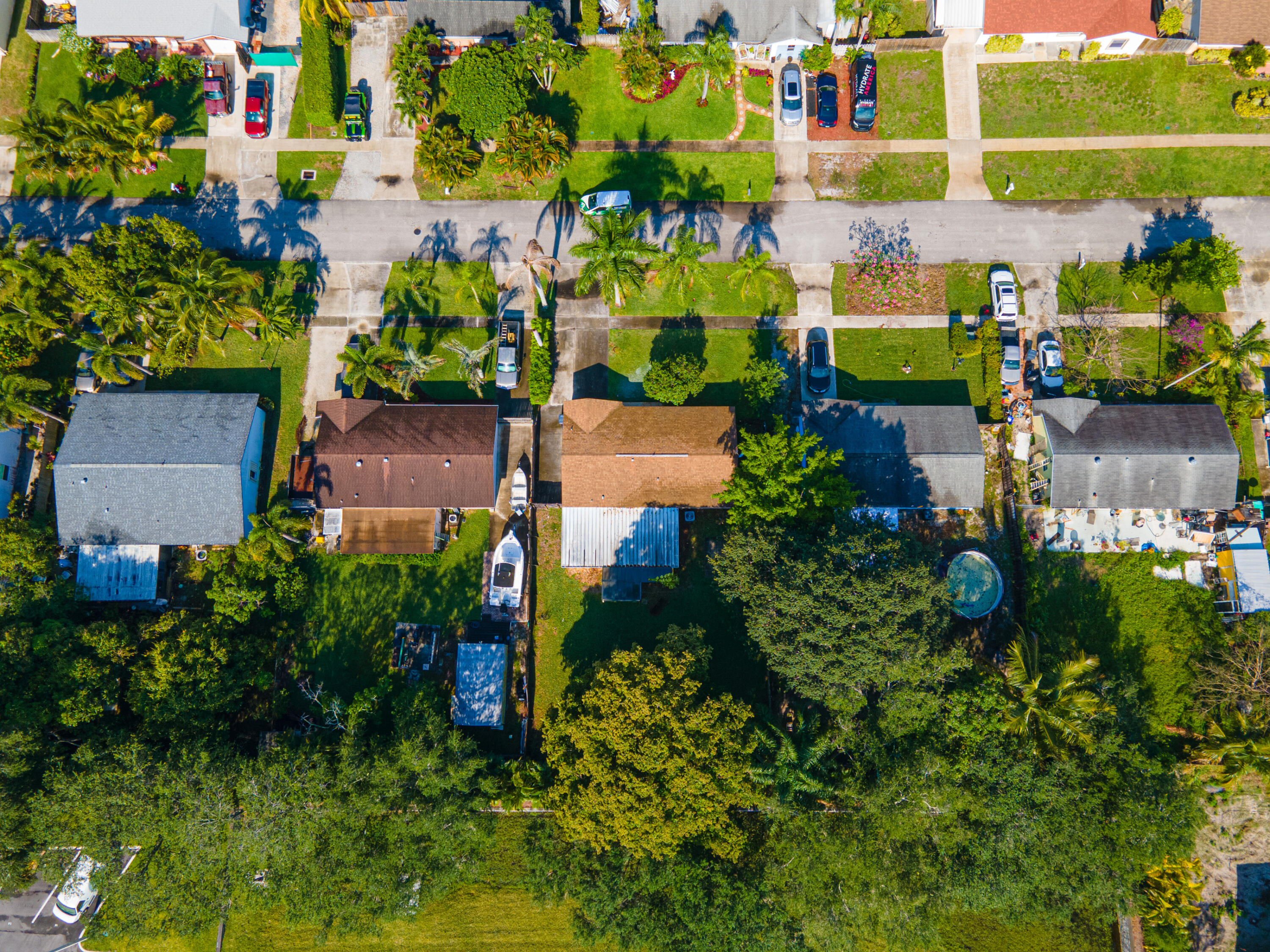 4661 Poseidon Place Lake Worth, FL 33463 - Photo 6 of 36 an aerial view of a house with a yard and lake view