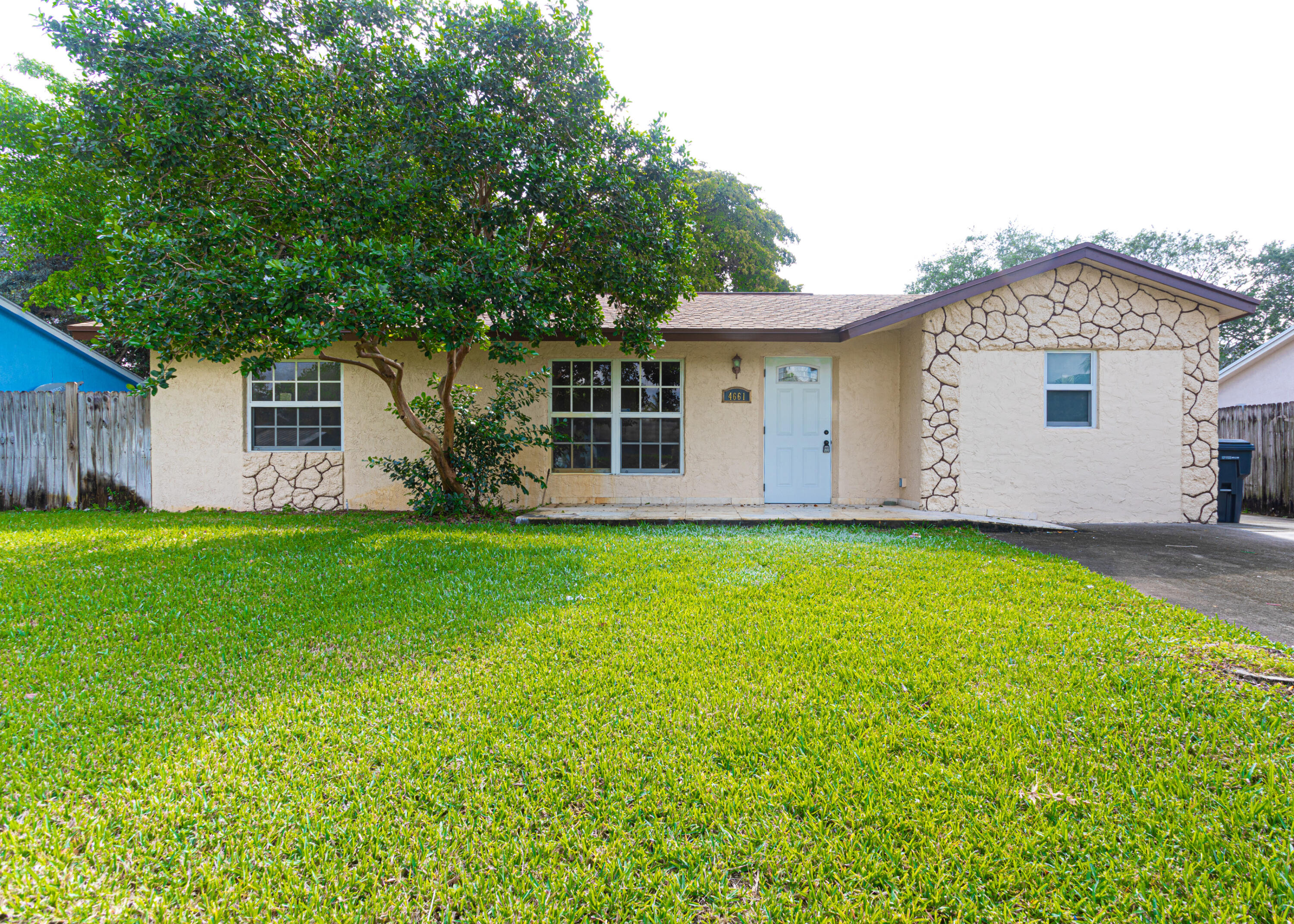 4661 Poseidon Place Lake Worth, FL 33463 - Photo 10 of 36 a view of a house with backyard and garden