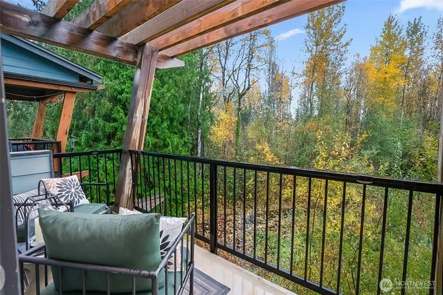 a view of a chair and table in the balcony