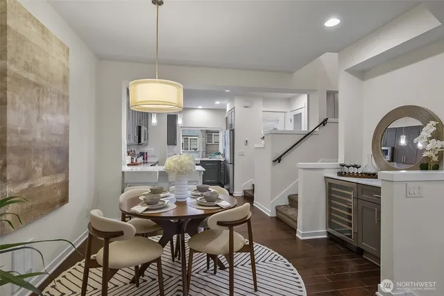 a view of a dining room with furniture and wooden floor