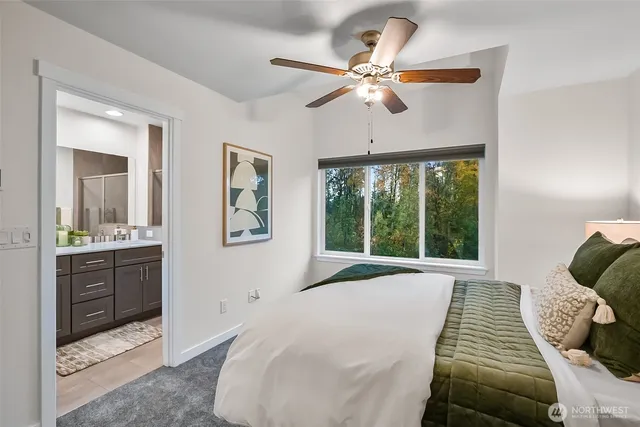 a bathroom with double vanity sinks and a mirror