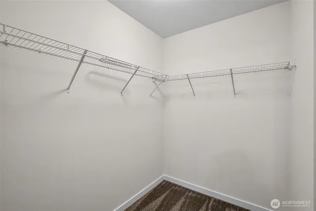 a view of a hallway with closet