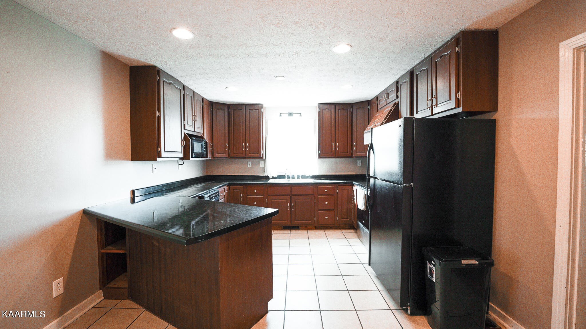 1440 Sulphur Springs Road Clinton, TN 37716 - Photo 14 of 24 a kitchen with granite countertop a refrigerator stove and sink