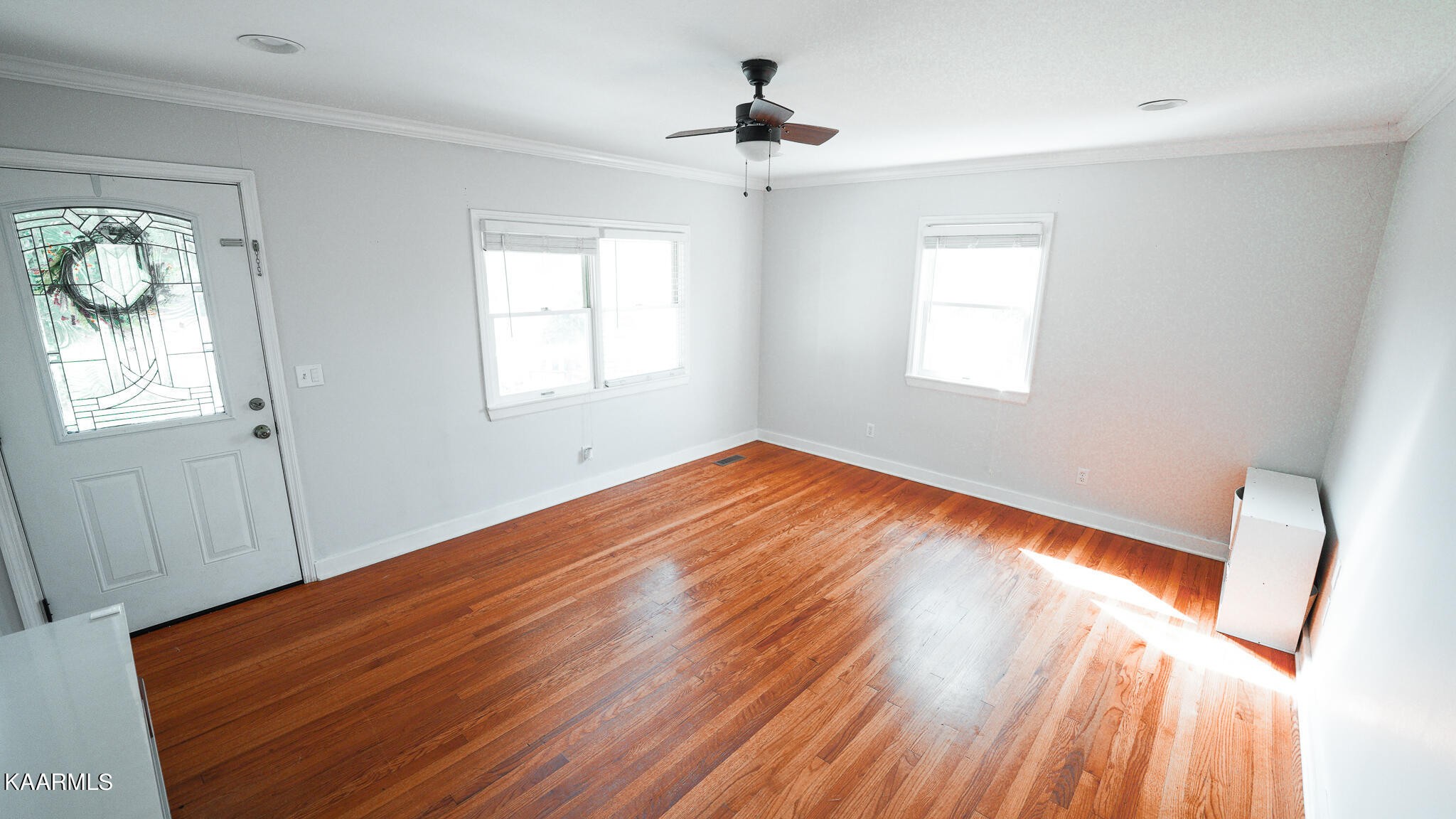 1440 Sulphur Springs Road Clinton, TN 37716 - Photo 7 of 24 a view of empty room with wooden floor and fan