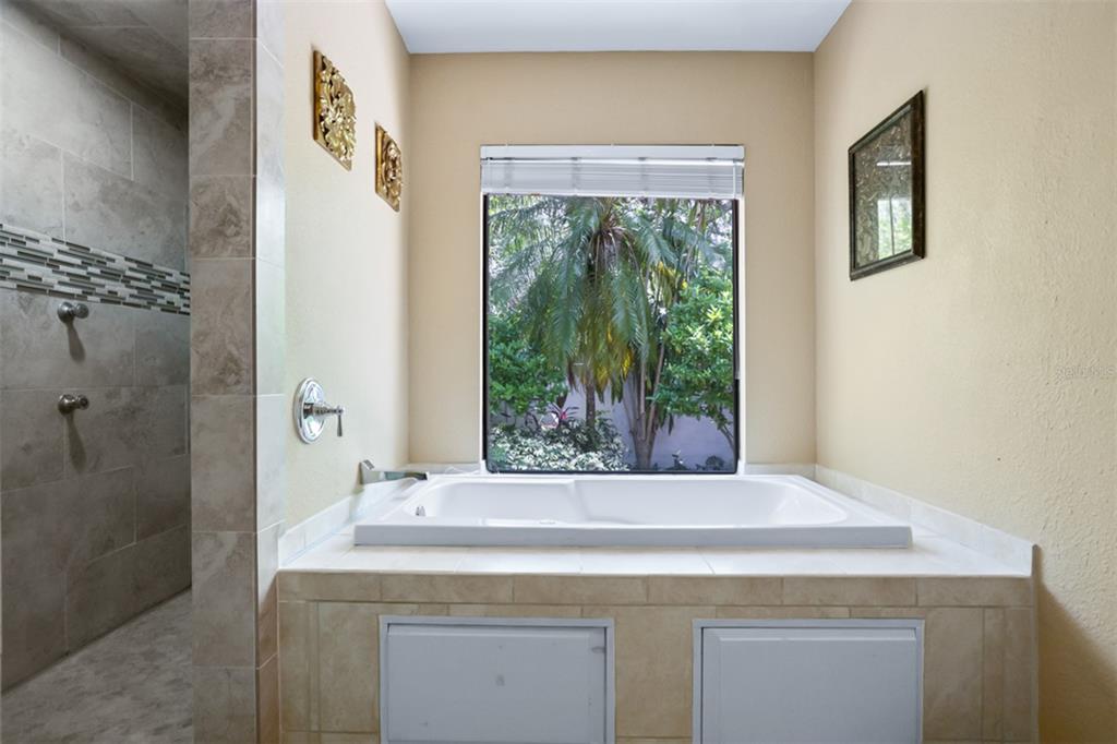 11407 Orilla Del Rio Place Temple Terrace, FL 33617 - Photo 16 of 39 a room with a sink and a mirror