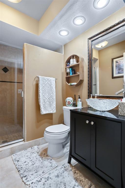 11407 Orilla Del Rio Place Temple Terrace, FL 33617 - Photo 19 of 39 a bathroom with a granite countertop sink toilet and a mirror