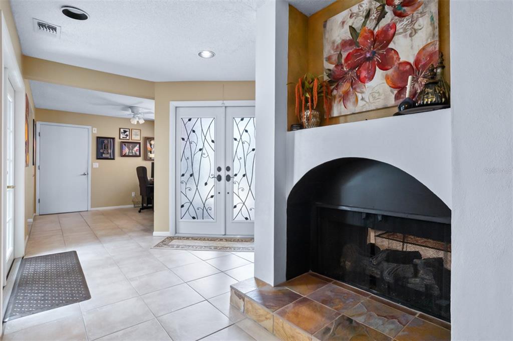 11407 Orilla Del Rio Place Temple Terrace, FL 33617 - Photo 2 of 39 a view of an empty room and fire place