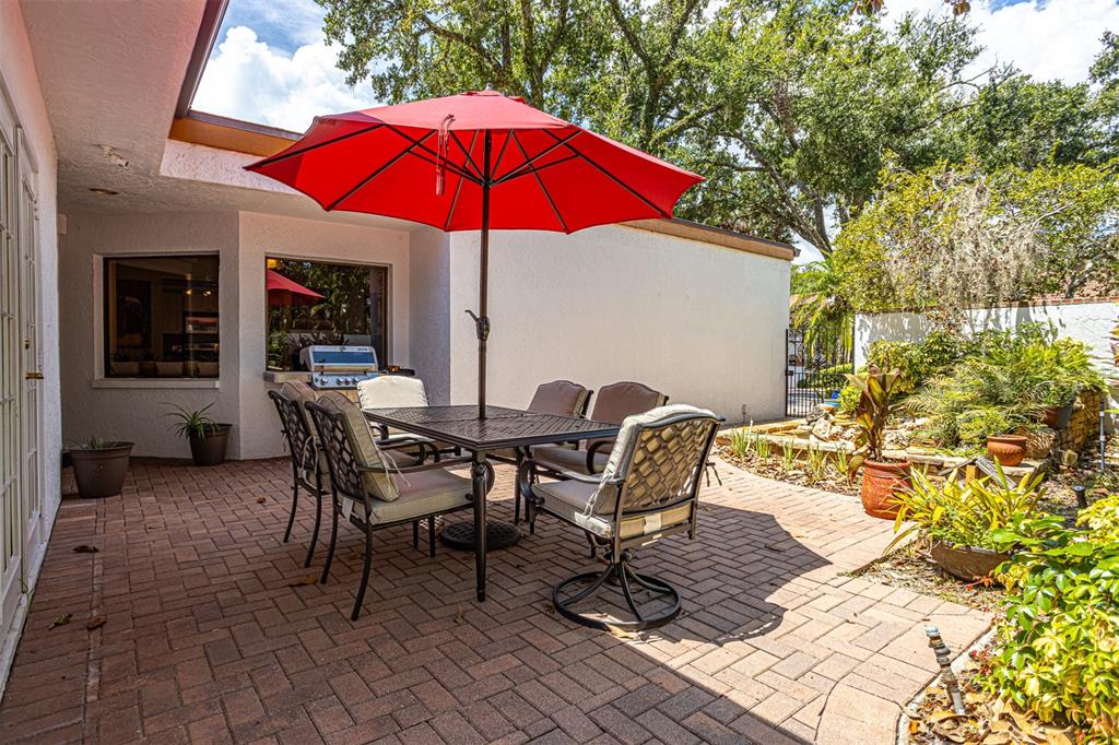 11407 Orilla Del Rio Place Temple Terrace, FL 33617 - Photo 23 of 39 a view of a backyard with sitting area