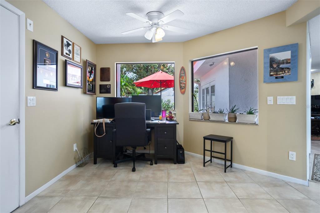 11407 Orilla Del Rio Place Temple Terrace, FL 33617 - Photo 7 of 39 a dining room with furniture and a chandelier