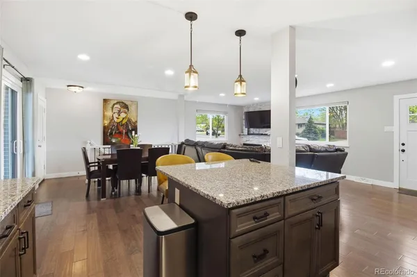 a view of kitchen island kitchen island granite countertop living room