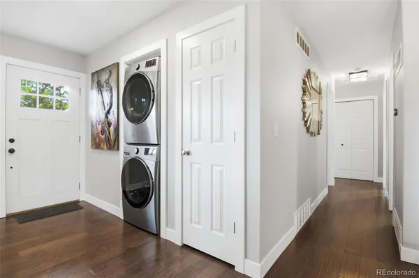 a view of a hallway with washer and dryer