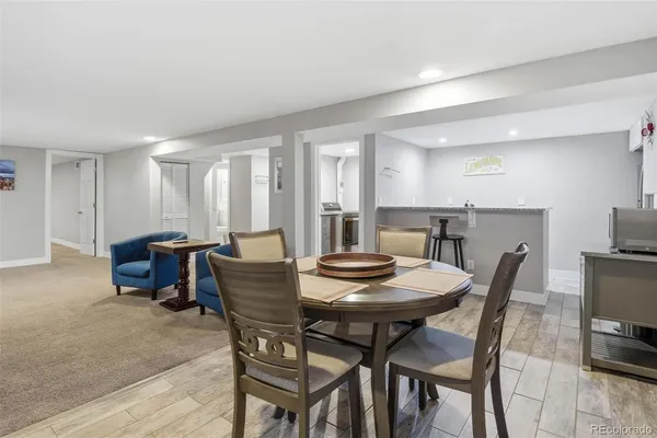 a dining room with furniture and window
