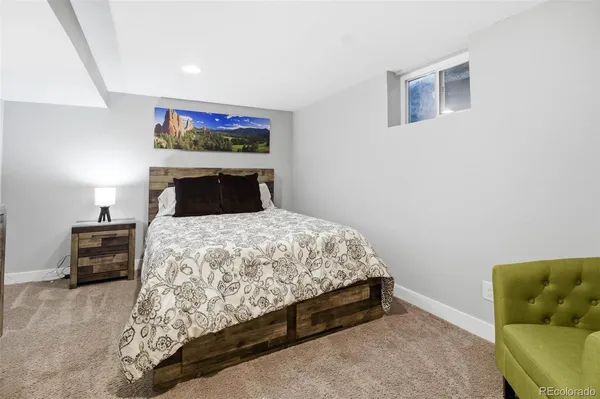 a bedroom with a bed and furniture