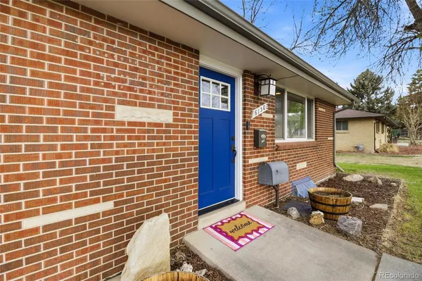 a brick building with a bench in front of it