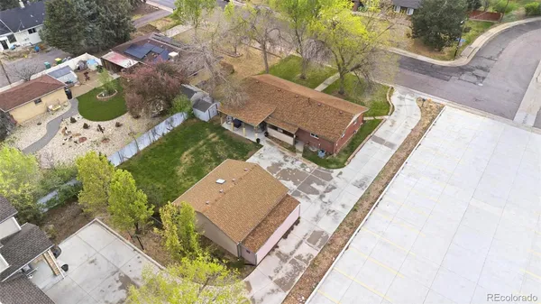 an aerial view of a house with a yard