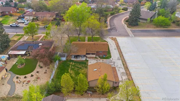 an aerial view of a house with a swimming pool