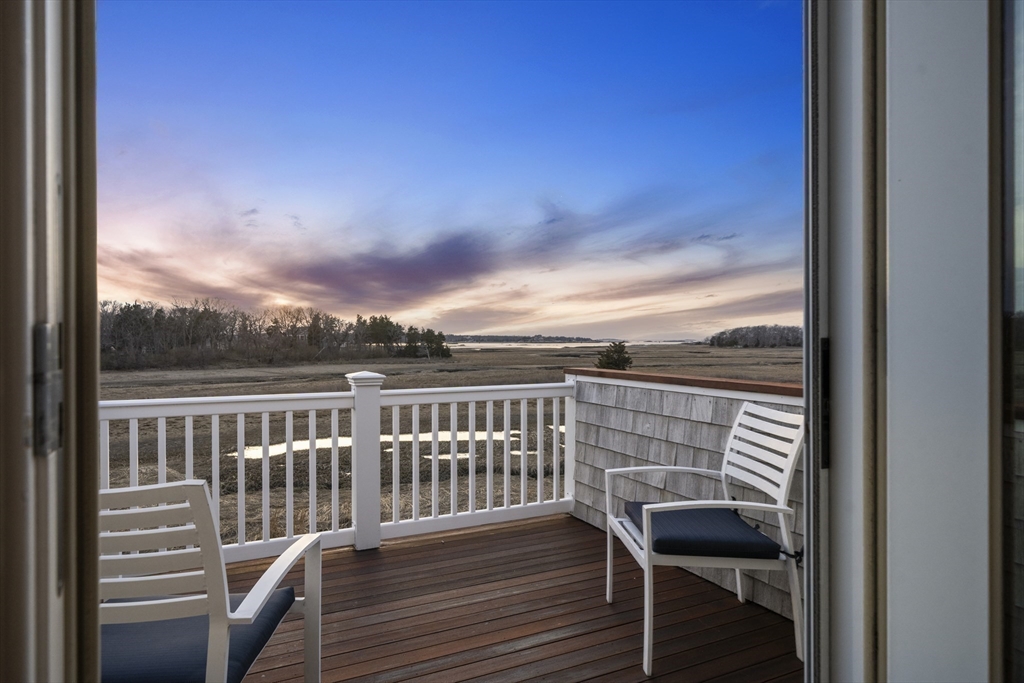 35 Bayberry Road Scituate, MA 02066 - Photo 22 of 39 a view of a balcony with wooden chairs