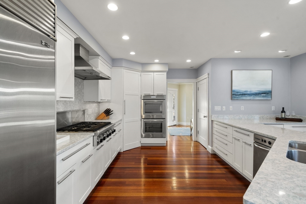35 Bayberry Road Scituate, MA 02066 - Photo 3 of 39 a kitchen with stainless steel appliances kitchen island granite countertop a stove and a refrigerator