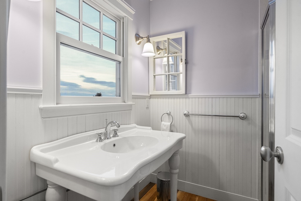 35 Bayberry Road Scituate, MA 02066 - Photo 37 of 39 a bathroom with a sink and a mirror