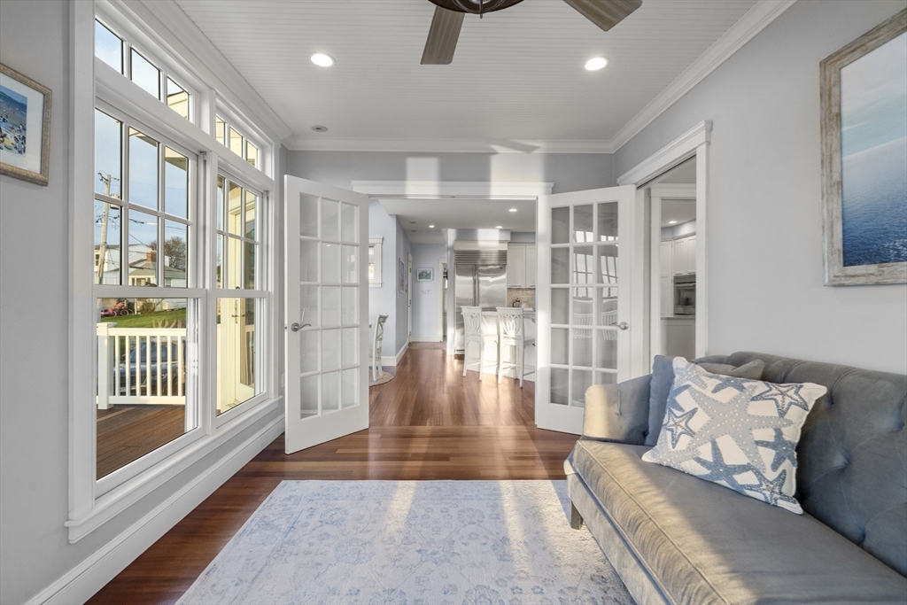 35 Bayberry Road Scituate, MA 02066 - Photo 9 of 39 a living room with furniture and a floor to ceiling window